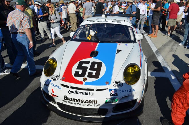 Brumos Racing's Porsche p11 GT3 Cup Car waited in the pit lane at Daytona International Speedway minutes before the start of the Rolex 24 at Daytona Jan. 26, 2013.