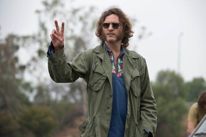 This photo provided by Warner Bros. Pictures shows Joaquin Phoenix as Larry "Doc" Sportello in "Inherent Vice." (Warner Bros. Pictures, Wilson Webb)