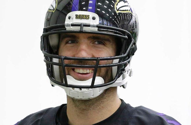 Baltimore Ravens quarterback Joe Flacco walks on the field during an NFL football practice, Wednesday, Jan. 7, 2015, in Owings Mills, Md. The Ravens will travel to New England for a divisional playoff game against the Patriots on Saturday, Jan. 10. (AP Photo/Patrick Semansky)