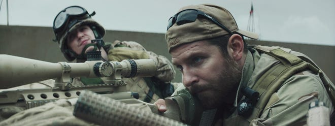 Kyle Gallner, left, as Goat-Winston and Bradley Cooper as Chris Kyle in Warner Bros. Pictures' and Village Roadshow Pictures' drama "American Sniper." (Photo courtesy Warner Bros. Pictures/TNS)