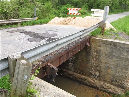 In this Tuesday, April 30, 2013, photo, a bridge in Cherokee County is closed in Blacksburg, S.C. The South Carolina Department of Transportation estimates it needs $29 billion over 20 years to bring the state's roads and bridges to good condition. (AP Photo/Jeffrey Collins)