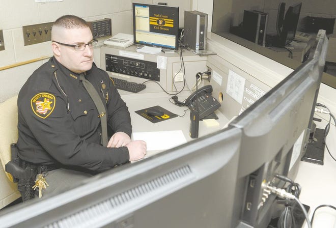 Deputy Donald Burns monitors Stark County Courthouse security cameras. An upgrade in security is planned for inside and outside the courthouse in downtown Canton and at the Frank T. Bow building nearby.