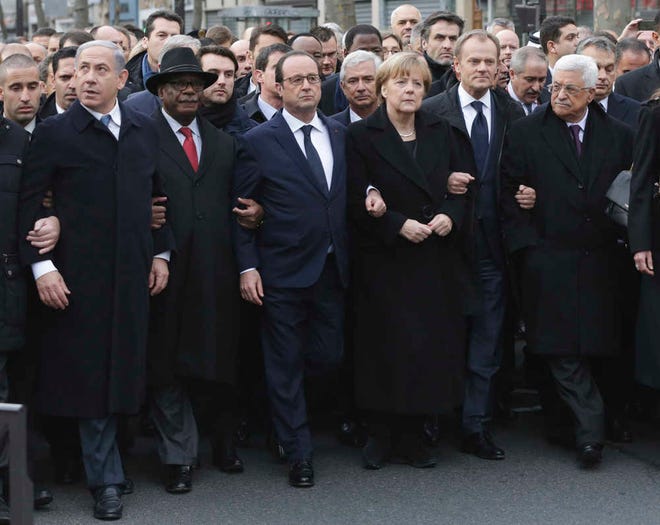 From the left : Israel's Prime Minister Benjamin Netanyahu, Mali's President Ibrahim Boubacar Keita, France's President Francois Hollande, Germany's Chancellor Angela Merkel, EU President Donald Tusk, and Palestinian President Mahmoud Abbas march during a rally in Paris, France, Sunday, Jan. 11, 2015. A rally of defiance and sorrow, protected by an unparalleled level of security, on Sunday will honor the 17 victims of three days of bloodshed in Paris that left France on alert for more violence. (AP Photo/Philippe Wojazer, Pool)