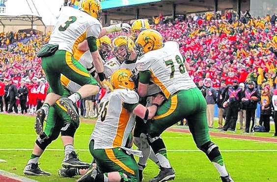 North Dakota State quarterback Carson Wentz, center, celebrates with 
teammates after scoring a go-ahead touchdown against the Illinois State in 
the second half of the FCS Championship game Saturday.
ASSOCIATED PRESS / TIM SHARP