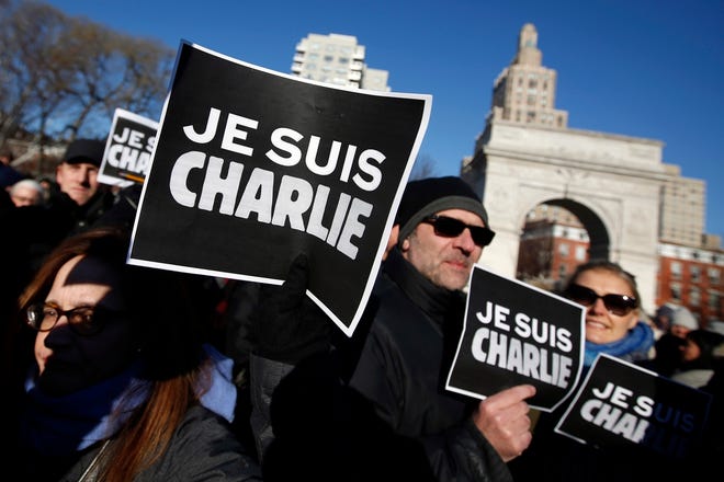 At a rally Saturday in New York's Washington Square Park, participants hold 
"Je Suis Charlie" (I am Charlie) signs to show solidarity with victims of 
recent terrorist attacks in Paris, including one at the office of weekly 
newspaper "Charlie Hebdo." Rallies were held in several cities Saturday, and 
a huge gathering is planned for today in Paris.AP PHOTO / JASON DECROW