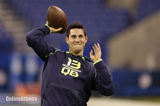 In this Feb. 23, 2014, file photo, Georgia quarterback Aaron Murray throws during a drill at the NFL football scouting combine in Indianapolis. While his buddies were bunking down to watch Jack Bauer on "24," or cruising through channels in search of a ballgame, Kansas City Chiefs quarterback Aaron Murray was settling in for another episode of "The Bachelorette." Thats because his brother, former minor league baseball player Josh Murray, is one of the eight beaus still in the mix. (AP Photo/Michael Conroy, File)
