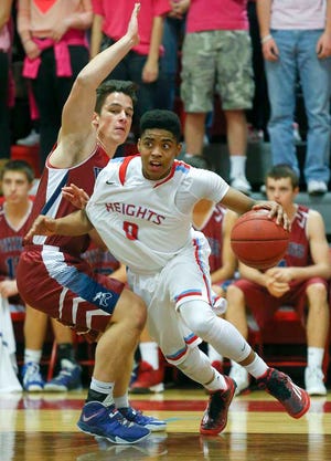 Tez Scroggins, right, and Shawnee Heights will clash with fellow unbeaten Hayden on Tuesday night.
