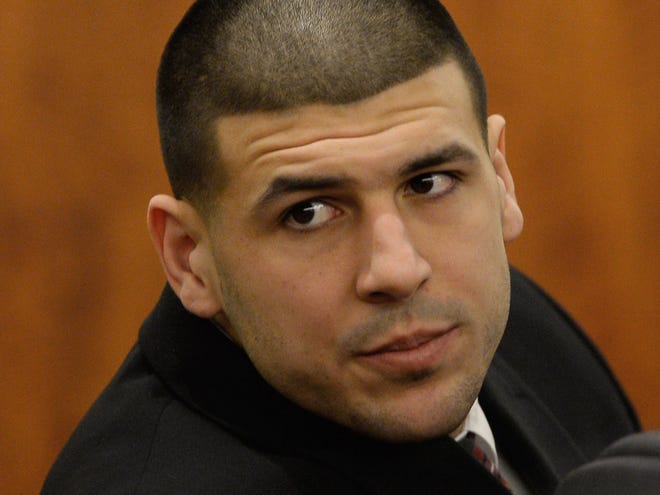 In this Jan. 6, 2015 file photo, former New England Patriots football player Aaron Hernandez attends a pretrial hearing in the first of two murder cases against him at Bristol County Superior Court in Fall River, Mass.