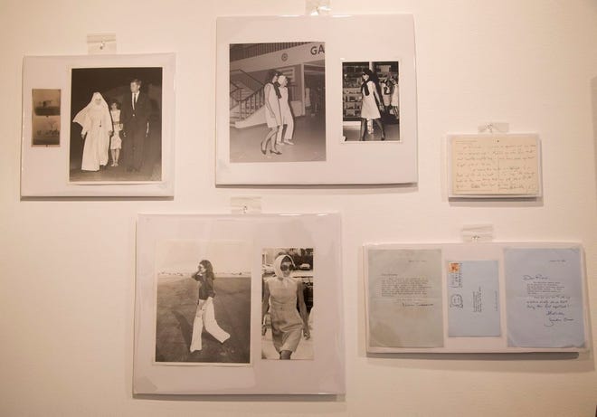In this Wednesday, Jan. 7, 2015 photo, groups of photos of Jacqueline Kennedy Onassis by Bob Davidoff, who spent decades as the Kennedy family's photographer in Palm Beach, and other personal correspondence written by Kennedy Onassis appear on display before they are auctioned off in West Palm Beach, Fla.