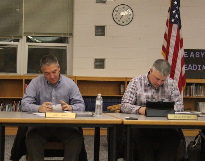 Lakewood Public Schools Board of Education members Jeff Gibbs, right, and Brian Potter cast votes for the office of board president during Monday evening’s meeting.