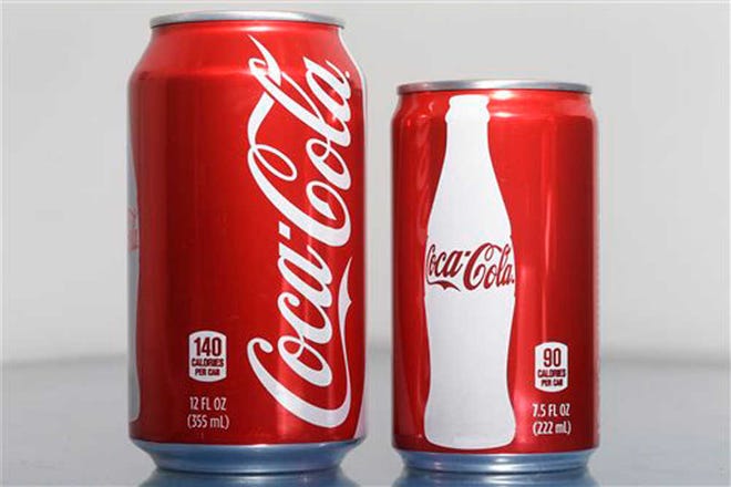 Matt Rourke/The Associated PressA 7.5-ounce can of Coca-Cola, right, is posed next to a 12-ounce can for comparison. As people cut back on soda, the two beverage giants, Coke and Pepsi, are increasingly pushing smaller cans and bottles they say contain fewer calories and induce less guilt, but they also cost more.