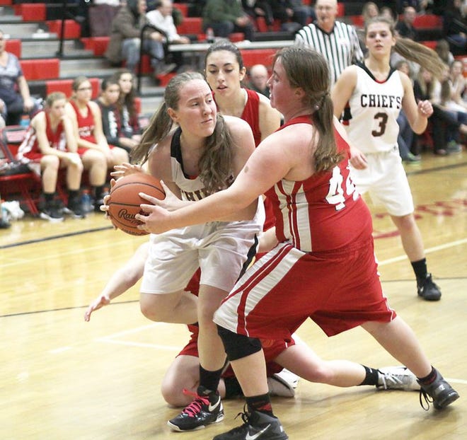 Hannah Carr of White Pigeon looks for an open teammate Tuesday night.