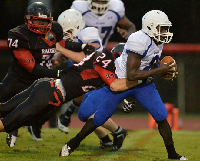 Wildwood senior Torre Parker (2) is tackled by South Sumter Devin Papenheim during an Aug. 29 game between South Sumter High School and Wildwood High School at Raider Field in Bushnell.