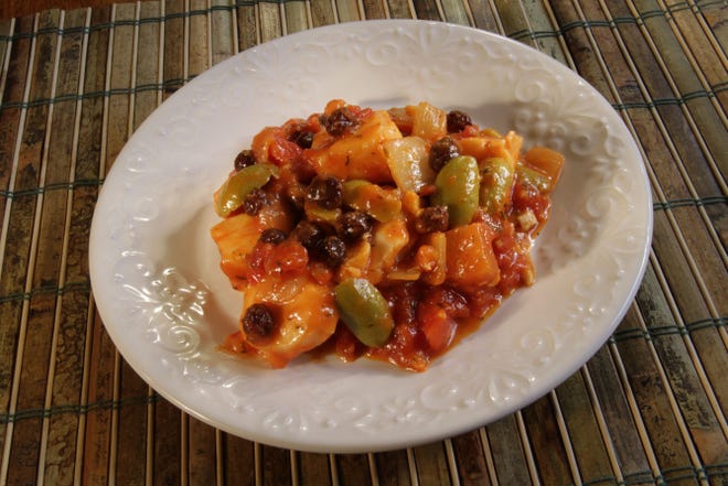 Fish is high in protein and low to moderate in fat. Pictured is Sicilian Fish with Raisins and Olives.