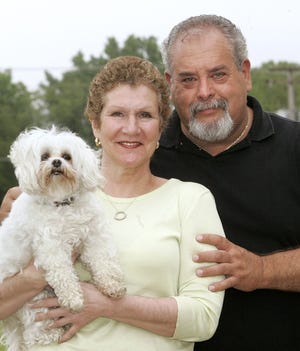 Sandi Johnson, shown here in 2008 with her husband Gary Johnson and her dog Spanky, lost her battle with breast cancer Monday. Johnson served as Harlem School Board President.

RRSTAR.COM FILE PHOTO