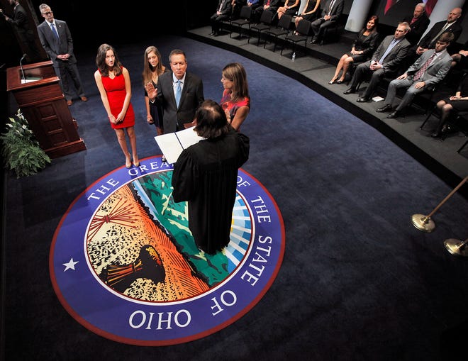 Governor John R. Kasich is sworn into office by Ohio Chief Justice Maureen O'Connor during his swearing in ceremony held at the Southern Theatre.