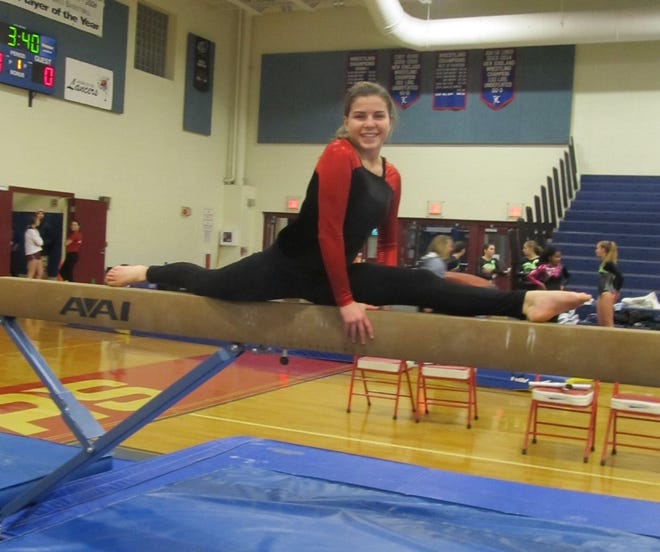 Spaulding’s Taryn Grant does a split on the beam warming up before a meet at Londonderry last Thursday.
