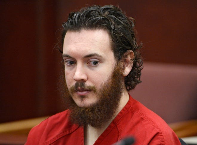 This June 4, 2013, file photo shows Colorado movie theater shooting suspect James Holmes, whose trial is to begin with lengthy jury selection on Jan. 20, 2015, sitting in Arapahoe County District Court in Centennial, Colo. Psychiatrists and attorneys interviewed by The Associated Press say that it would be unlikely that Holmes would be released from a state mental institution should a jury find him not guilty by reason of insanity.