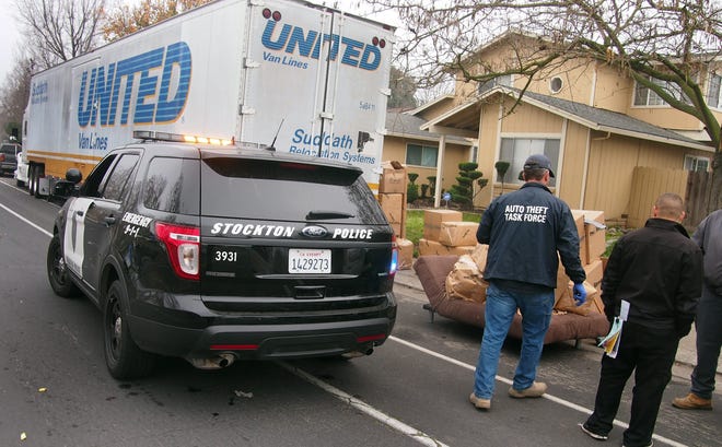 A stolen big rig loaded with household goods is recovered Wednesday during an multi-police agency operation at Estate and Otto Drive in north Stockton. CALIXTRO ROMIAS/THE RECORD