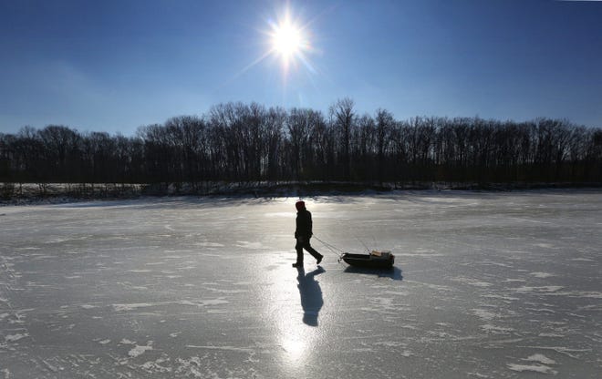 An ice fisherman has no qualms as he crosses the Alum Creek Reservoir before settling down on the east side near Africa Road. Yesterday was cold enough for such a jaunt on the ice, but with several days of above-freezing temperatures forecast to start today, he might want to stay on solid ground next time out.