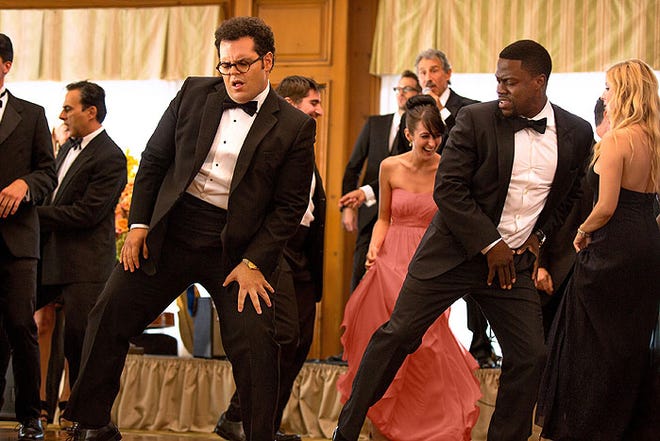 Jimmy (Kevin Hart), right, and Doug (Josh Gad) test out their dance moves.