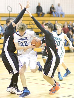 Central Valley Academy's Michael Bergin slips between two Rome Free Academy defenders on his way to the basket Tuesday. 



Photo Courtesy of Bob Critser, digitalsportsphotography.net