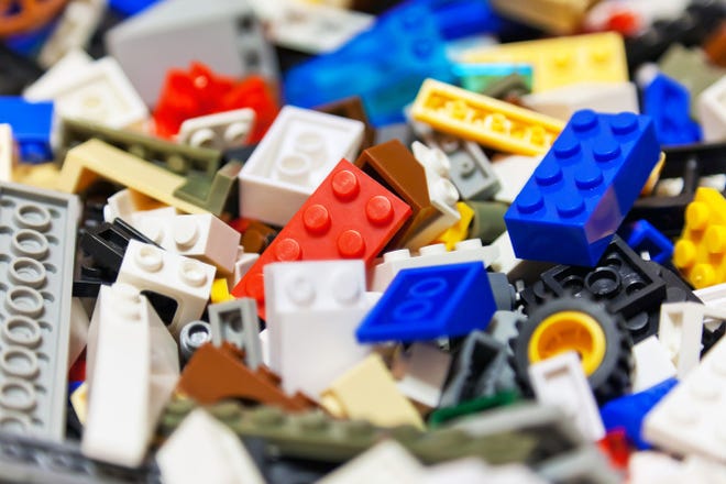 To wash Legos, put the pieces in a mesh laundry bag, zip it closed and toss into the washing machine full of hot water and a bit of soap. When the cycle is over, let the Legos dry on a towel.