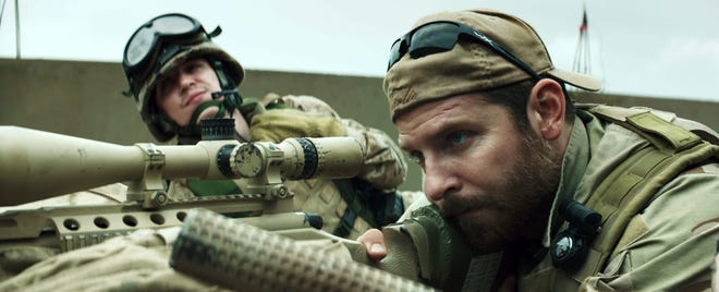 In this image released by Warner Bros. Pictures, Kyle Gallner, left, and Bradley Cooper appear in a scene from "American Sniper." The film is based on the autobiography by Chris Kyle. (Warner Bros. Pictures)