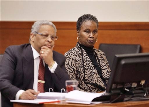Sheila Kearns, right, listens to testimony in judge Schneider's Common Pleas Courtroom with attorney Geoffrey Oglesby on Tuesday, Jan. 13, 2015. The former substitute teacher who showed a movie featuring graphic sex and violence to a high school class has been convicted of disseminating matter harmful to juveniles. (AP Photo/The Columbus Dispatch, Chris Russell)