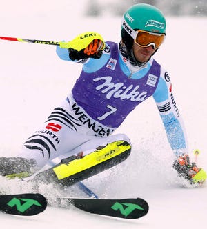 Germany's Felix Neureuther captured a men's World Cup slalom race in Wengen, Switzerland, to reclaim the lead in the discipline standings from Austria's Marcel Hirscher.