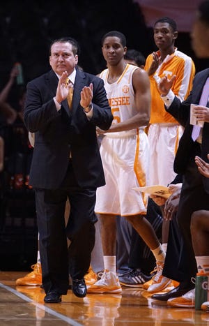 Tennessee Coach Donnie Tyndall, left, has applauded his undermanned team's effort during his his first season in Knoxville, Tenn. The Volunteers are 10-5 a pair of victories over ranked teams heading into Saturday's 5 p.m. tip-off against Missouri at Mizzou Arena.