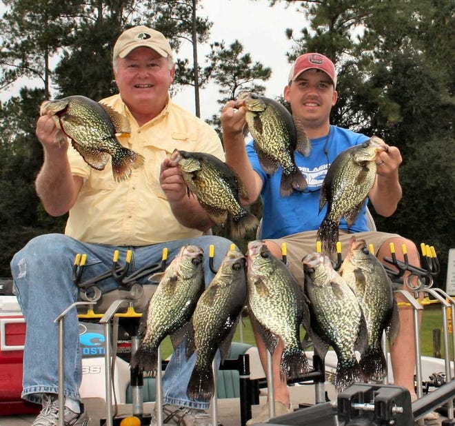 Bob McNally For the Times-Union Bob McNally (left) and T.C. Lloyd show a catch of crappies from Rodman Reservoir.