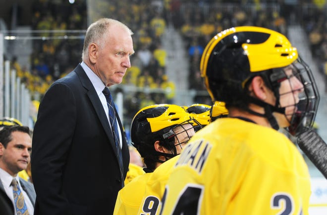 Michigan Coach, Red Berenson, watches the game between Michigan and Minnesota at Yost Arena in Ann Arbor on Saturday, Jan. 10, 2015. (AP Photo/The Ann Arbor News, Nicole Hester)