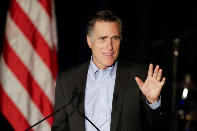 Mitt Romney, the former Republican presidential nominee, speaks during the Republican National Committee's winter meeting aboard the USS Midway Museum Friday, Jan. 16, 2015, in San Diego. Neither Hillary Rodham Clinton nor Mitt Romney have yet said they’re running for president. But within a few hours on Friday, the likely candidates previewed a 2016 campaign that appears headed to a debate over who is best able to boost the paychecks of every day Americans. (AP Photo/Gregory Bull)