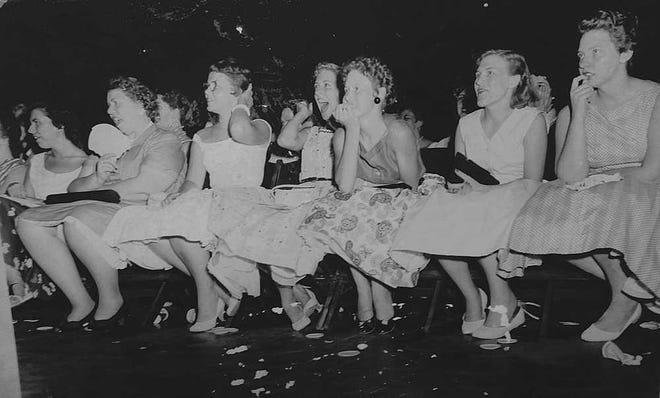 The front row goes wild during the June 1956 Elvis concert in Augusta.