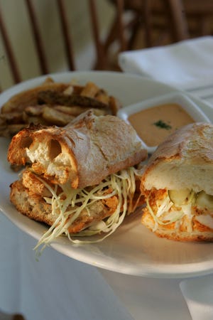 Shrimp Po-Boy, crunchy on the outside and airy on the inside, is loaded with fried shrimp and dressed with shredded cabbage, dill pickles and a tasty remoulade sauce.