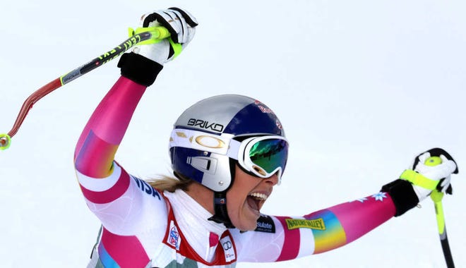 Lindsey Vonn celebrates in the finish area after winning an alpine ski, women's World Cup downhill Sunday in Cortina d'Ampezzo, Italy. Lindsey Vonn won a downhill Sunday to match Annemarie Moser-Proell's 35-year-old record of 62 World Cup wins, capping a comeback from two serious knee surgeries.