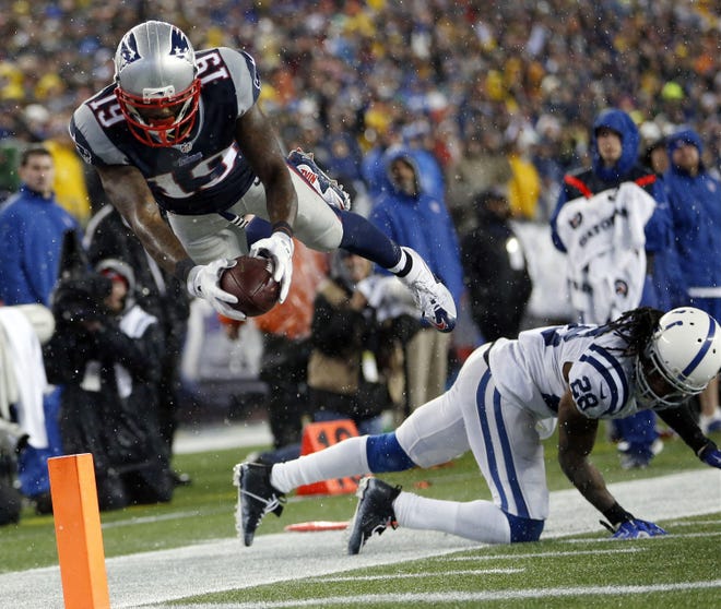 Patriots wide receiver Brandon LaFell dives over Colts cornerback Greg Toler, but he had stepped out of bounds before reaching the end zone during the second half. Julio Cortez/THE ASSOCIATED PRESS
