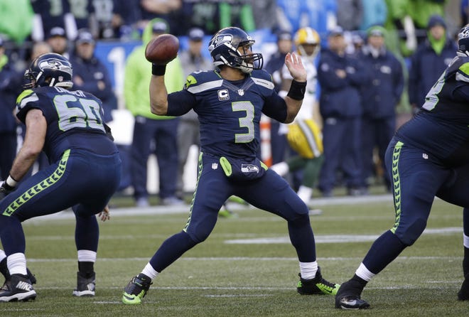 Seattle Seahawks quarterback Russell Wilson (3) throws against the Green Bay Packers during the second half of the NFL football NFC Championship game Sunday in Seattle.