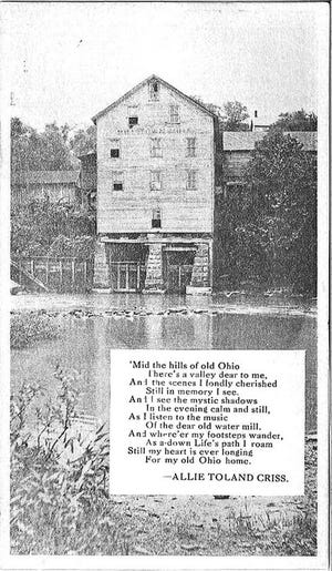 This postcard shows the old mill in New Cumberland on the banks of Conotton Creek.