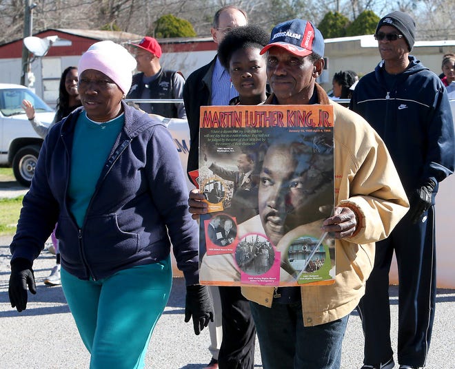 Residents march Monday morning through Thibodaux to celebrate the birthday of Dr. Martin Luther King Jr.