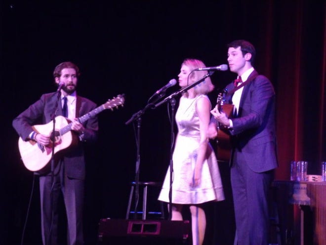 From left, Eli Zoller, Sarah Hunt and Chris Ware of A Band Called Honalee sing during their performance Saturday at Hutchinson's Historic Fox Theatre.