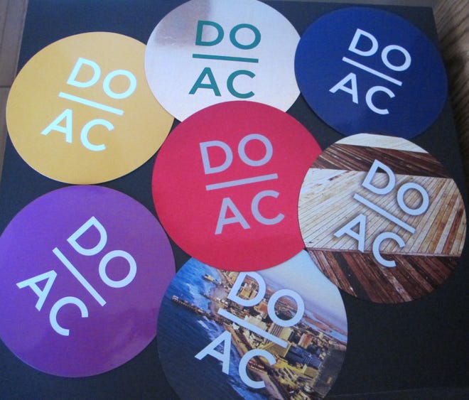 This Jan. 17, 2015 shows the popular "Do AC" car magnets produced by The Atlantic City Alliance to promote tourism in Atlantic City, N.J. The group, which promotes the resort to other parts of the country and stages free public events like beach concerts and fireworks, would be abolished and its $30 million annual budget redirected to other uses under pending state legislation. (AP Photo/Wayne Parry)
