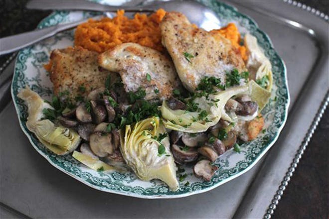 MatthewMead/The Associated PressChicken with tangy artichoke and mushroom sauce is an easy dish for date night.