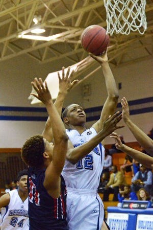Westover's Jozef Vanderhorst goes up for a shot over Terry Sanford's Isaiah Stallings.