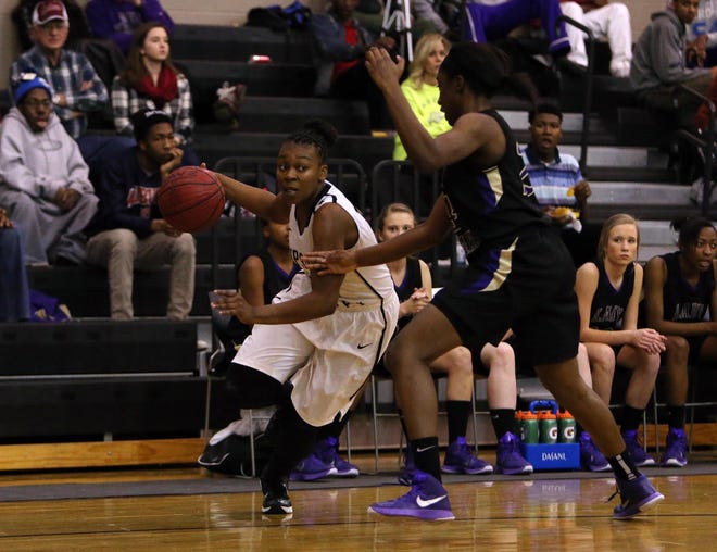 Sipsey Valley's Charity Brown, left, drives past Bibb County's Jaunequa Steele.