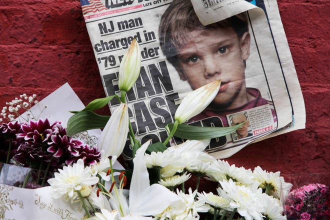FILE - This May 28, 2012, file photo shows a newspaper with a photograph of Etan Patz that is part of a makeshift memorial in the SoHo neighborhood of New York. Jury selection is set to start Monday, Jan. 5, 2015, in Hernandez’s murder trial. As the murder case surrounding Patz' notorious 1979 disappearance heads to trial, missing-children’s advocates see it as proof that such cases still can be pursued after decades. (AP Photo/Mark Lennihan, File)