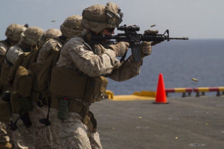 Marines from the 24th Marine Expeditionary Unit participate in a live-fire exercise aboard the amphibious assault ship USS Iwo Jima (LHD 7), Jan. 18, 2015. The 24th MEU is embarked on the ships of the Iwo Jima Amphibious Ready Group and deployed to maintain regional security in the U.S. 5th Fleet area of operations.