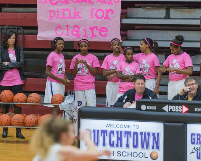 Both teams wore pink shirts that read, "Geaux Pink for Claire." Photo by Dewey Keller.