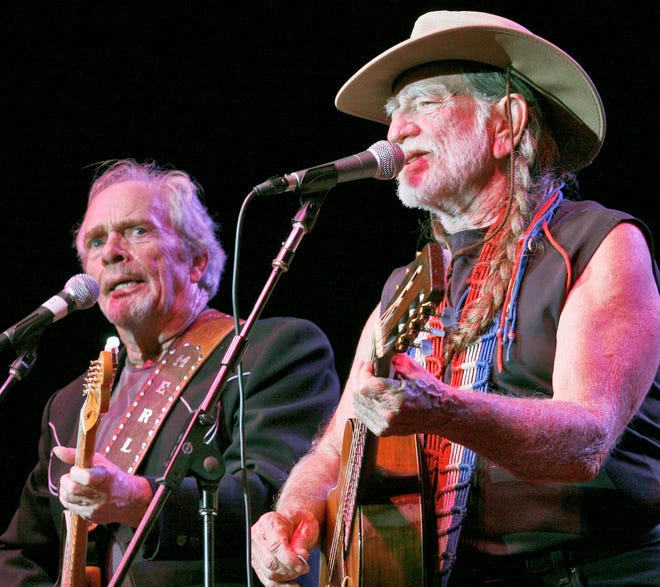 Merle Haggard, left, and Willie Nelson perform a duet in 2007.